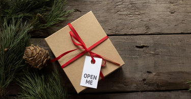 Gift box with Open Me title on tag