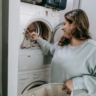 Woman choosing clothes for for washing